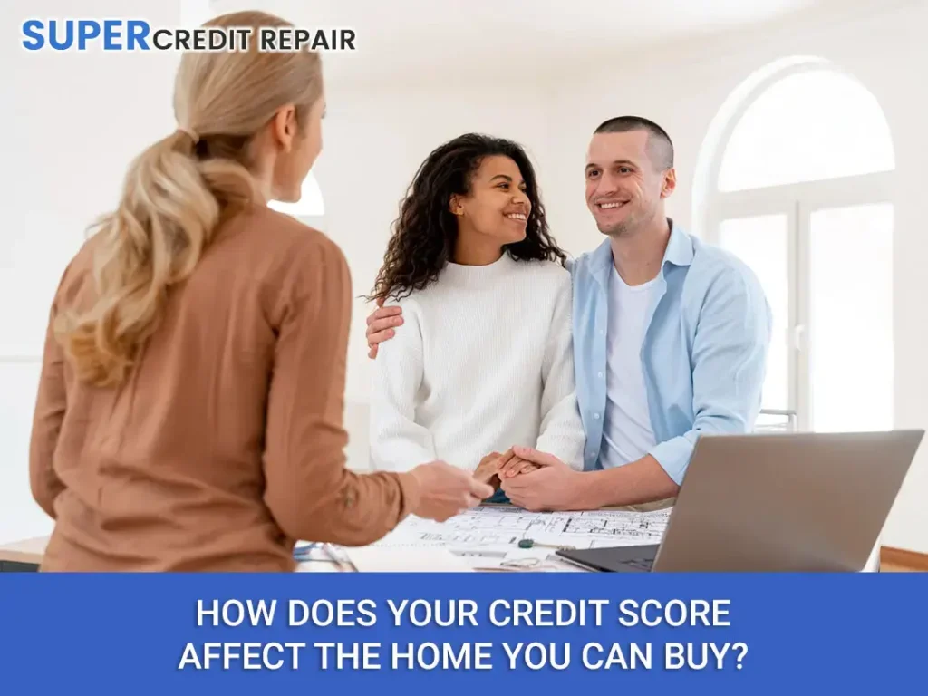 How Does Your Credit Score Affect the Home You Can Buy? A couple smiling and holding hands while sitting at a table with a laptop and documents talking to a woman